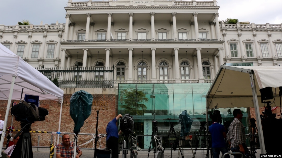 Journalists wait in front of Palais Coburg where closed-door nuclear talks with Iran take place in Vienna, Austria, July 7, 2015.