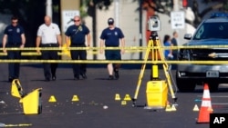 Bodies are removed from at the scene of a mass shooting, Aug. 4, 2019, in Dayton, Ohio. 