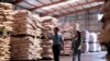 FILE - A Chinese pig farmer Sun Dawu is shown inside a feed warehouse in Hebei, outside Beijing, Sept. 24, 2019. 