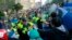 Demonstrators protesting against a China Taiwan trade pact clash with riot police clearing the government Cabinet buildings in Taipei, Taiwan, Monday, March 24, 2014.