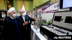 Iranian President Hassan Rouhani reviews his country's new nuclear achievements during Iran's National Nuclear Technology Day, in Tehran, Iran, April 10, 2021. (Iranian Presidency Office/West Asia News Agency/Handout via Reuters) 