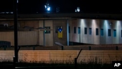 An "estelada" or independence flag is waved from the window of a cell in Lledoners prison, in Sant Joan de Vilatorrada, about 50 kilometers away from Barcelona, Spain, Sept. 18, 2018. 