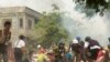 Protesters take cover during clashes with security forces in Monywa, Myanmar, on March 21, 2021, in this still image from a video obtained by Reuters. 