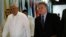 Philippine Foreign Affairs Secretary Albert Del Rosario (L) walks with U.S. Representative Chris Smith upon arrival at the Department of Foreign Affairs headquarters in Pasay city, metro Manila, Nov. 25, 2013. 