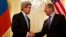 U.S. Secretary of State John Kerry, left, shakes hands with Russian Foreign Minister Sergey Lavrov before the start of their meeting at the Russian Ambassador&#39;s residence about the situation in Ukraine, in Paris, March 30, 2014.