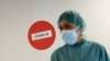 A hospital staff member is pictured before treating a patient suffering from COVID-19 at Hospital del Mar, where an additional ward has been opened to deal with an increase in coronavirus patients in Barcelona, Spain, July 15, 2021. 