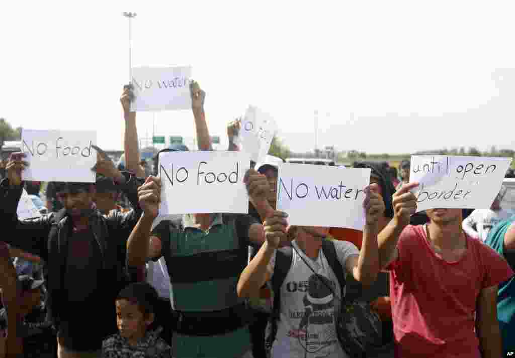 Migrants protest at the Horgos border crossing into the Hungary, near Horgos, Serbia.