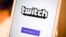 FILE - A Twitch sign-in screen is seen at the offices of Twitch Interactive Inc., a social video platform and gaming community owned by Amazon, in San Francisco, March 6, 2017.
