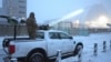 A Ukrainian serviceman stands on a vehicle with an anti-aircraft gun after a drone attack at the former Chernobyl nuclear power plant, Ukraine, Feb. 14, 2025.