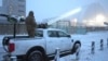 A Ukrainian serviceman stands on a vehicle with anti-aircraft gun after a drone attack at the former Chernobyl nuclear power plant, Ukraine, Feb. 14, 2025.