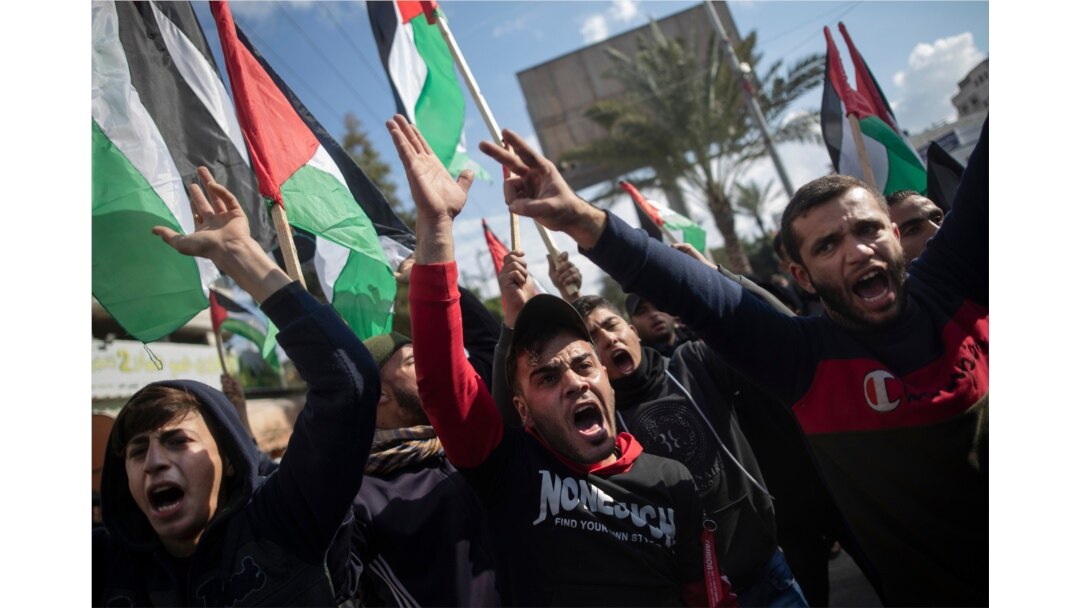 Palestinian protesters chant angry slogans during a protest against a new U.S. Mideast peace plan, in Gaza City, Jan. 28, 2020.