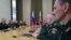 Russian President Vladimir Putin, background center, leads a meeting with the top military brass in the Bocharov Ruchei residence in the Black Sea resort of Sochi, Russia, May 15, 2018. Putin says the new weapons presented this year will ensure Russia's security for decades to come.