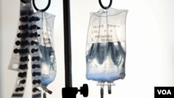 Intravenous bags hang above young cancer patients at Rady's Children Hospital in San Diego, California, Sept. 4, 2019. 