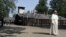 Pope Francis walks through the gate of the former Nazi German death camp of Auschwitz in Oswiecim, Poland, July 29, 2016.