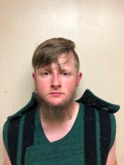 This handout booking photo released by the Crisp County Sheriff's Office on March 16, 2021 shows 21-year-old shooting suspect Robert Aaron Long.