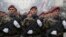 Members of the police forces of the Republika Srpska stand guard moments before a parade marking the 26th anniversary of the republic in the Bosnian town of Banja Luka, Jan. 9, 2018.