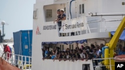 FILE - In a Aug. 15, 2018 file photo, the Aquarius rescue ship enters the harbor of Senglea, Malta. Spain’s maritime rescue service said Sunday, Sept. 23, 2018 that it rescued more than 400 people from 15 small boats, most of them off the country’s southern coast, while humanitarian groups lamented that the sole private rescue boat operating near the deadly central Mediterranean human trafficking route risked being put out of action by Italy’s anti-migrant leaders. 