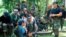 FILE - Undated photo of Abu Sayyaf spokesman Abu Sabaya, right foreground. Philippine troops captured an Abu Sayyaf rebel commander blamed for years of ransom kidnappings and on March 21, 2021 rescued the last of his four Indonesian captives.