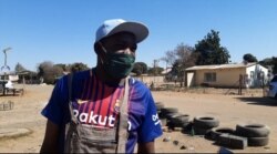 Business owner and ZANU-PF supporter Samson Malibho says he was against the protests because they affect his business of mending tires in Highfields, one of Harare’s poorest suburbs, July 31, 2020. (Columbus Mavhunga/VOA)