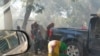 People react to tear gas outside the Malawi Congress Party headquarters in Lilongwe, Malawi, June 6, 2019, in this still image obtained from video taken from social media. 