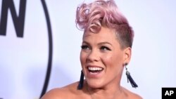 FILE - Pink arrives at the American Music Awards at the Microsoft Theater in Los Angeles, Nov. 19, 2017.