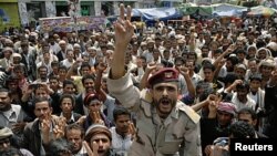 A former army officer, who defected to join anti-government protesters, shouts slogans during a rally demanding the ouster of Yemen's President Ali Abdullah Saleh in Sana'a October 4, 2011.