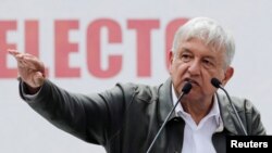 FILE - Mexico's President-elect Andres Manuel Lopez Obrador speaks during a rally as part of a tour to thank supporters for his victory in the July 1 election, in Mexico City, Sept. 29, 2018. 