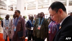 Delegates from Burkina Faso enter the main hall before the opening ceremony of the Forum on China-Africa Cooperation (FOCAC) in Beijing's Great Hall of the People, Sept. 5, 2024.