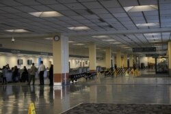 A nearly empty lobby at the North Terminal of the Ted Stevens Anchorage International Airport in Anchorage, Alaska, is shown, Jan. 28, 2020.