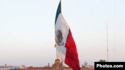 Mexican flag in plaza, Mexico City.