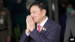 FILE - Thai former Prime Minister Thaksin Shinawatra arrives at Don Muang airport in Bangkok, Thailand, on Aug. 22, 2023.