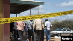 Kenyan security forces secure the African Inland Church after an attack in Kenya's northern town of Garissa, July 1, 2012. 