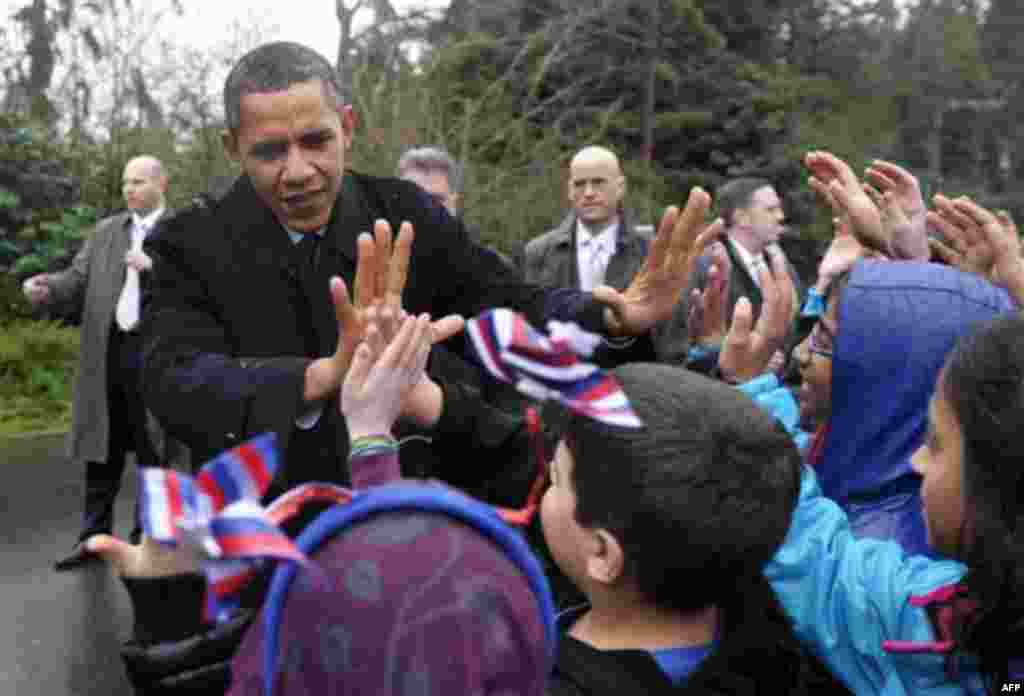 President Barack Obama greets school children from Medina Elementary School in Medina, Wash., Friday, Feb. 17, 2012. Obama, who attended a fundraiser nearby, is on a three-day trip to the West Coast. (AP Photo/Susan Walsh)