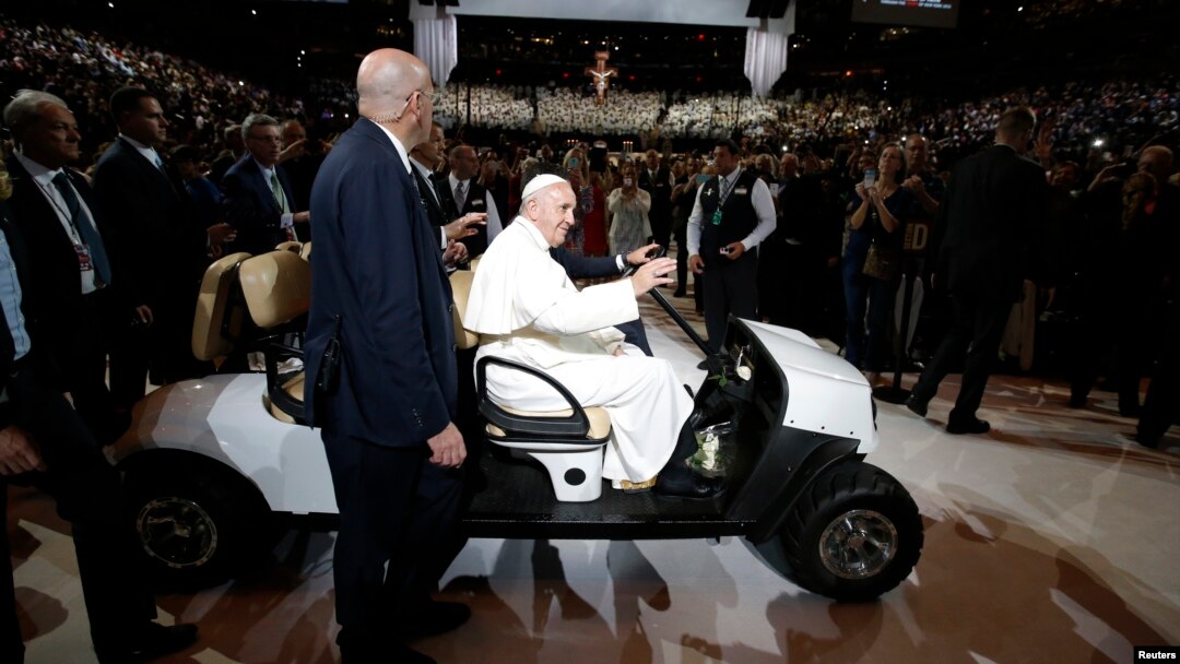 Pope Francis is driven on a golf cart as he arrives at Madison Square Garden to celebrate mass in New York, Sept. 25, 2015. 