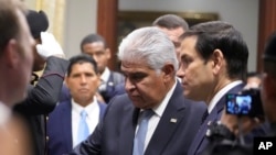 Panama's President Jose Mulino, left, and U.S. Secretary of State Marco Rubio arrive for a meeting at the presidential palace in Panama City, Feb. 2, 2025.