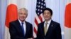 U.S. Defense Secretary Chuck Hagel (L) and Japan's Prime Minister Shinzo Abe shake hands before their meeting at the latter's former official residence in Tokyo, April 5, 2014. 