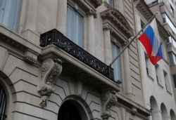 The Russian flag flutters on the Consulate-General of the Russian Federation in New York City, April 15, 2021.