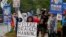 Protesters call for the release of U.S. Army Private First Class Bradley Manning on the road outside the main gate at the U.S. Army's Fort George G. Meade in Maryland Jun. 3, 2013. 