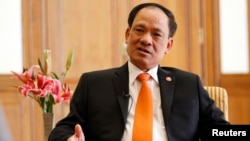 Association of Southeast Asian Nations (ASEAN) Secretary-General Le Luong Minh speaks during a Reuters interview at a hotel in Naypyitaw, Nov. 11, 2014. 