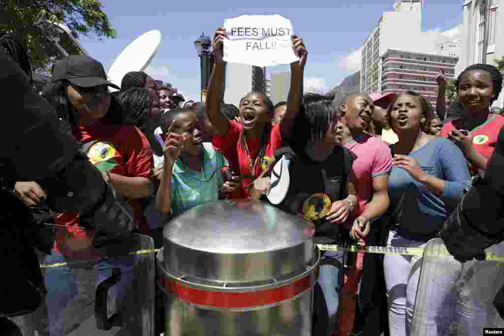 Students protest over planned increases in tuition fees outside South Africa&#39;s Parliament in Cape Town.