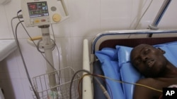 A male patient lies in a ward that specializes in the treatment of AIDS at a hospital in Dakar, Senegal Thursday, Dec. 1, 2005. 