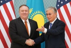 FILE - U.S. Secretary of State Mike Pompeo meets Kazakh President Kassym-Jomart Tokayev at the Akorda presidential residence in Nur-Sultan, Kazakhstan, Feb. 2, 2020.