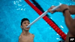 Eigo Tanaka from Japan practices the start of the race during a warm up session ahead of a competition, during the 2024 Paralympics in Paris, France.