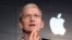 FILE - Apple CEO Tim Cook responds to a question during a news conference at IBM Watson headquarters, in New York. 