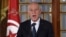FILE - Tunisian President Kais Saied gives a speech at the new government's swearing-in ceremony at the Carthage Palace outside the capital Tunis, on Feb. 27, 2020.