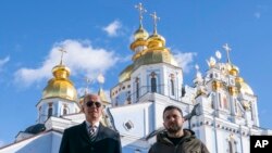U.S. President Joe Biden walks with Ukrainian President Volodymyr Zelenskyy at St. Michael's Golden-Domed Cathedral on a surprise visit, Monday, Feb. 20, 2023, in Kyiv. (AP Photo/ Evan Vucci)