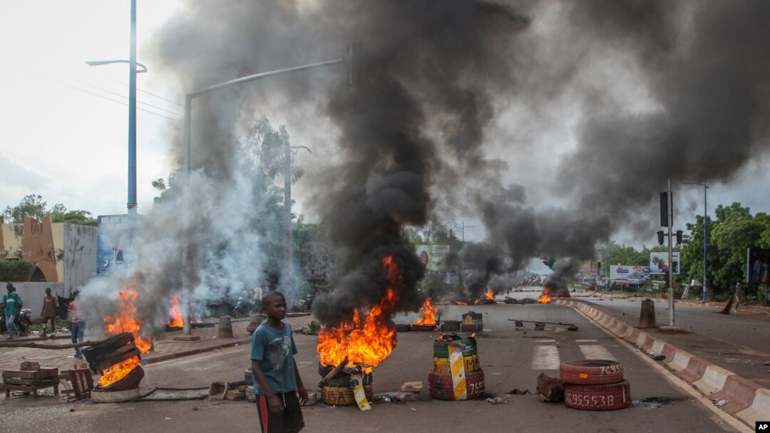 Anti-government protesters burn tires and barricade roads in the capital Bamako, Mali, July 10, 2020.