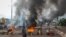 Anti-government protesters burn tires and barricade roads in the capital Bamako, Mali, July 10, 2020.