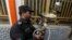 A policeman confiscates shisha water pipes from a shisha cafe during a raid in Kabul, Afghanistan, Nov. 27, 2016. 