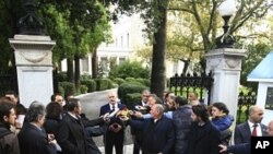 Greek Prime Minister George makes statements outside the presidential palace after his meeting with the Greek President Karolos Papoulias in Athens, October 17, 2011.